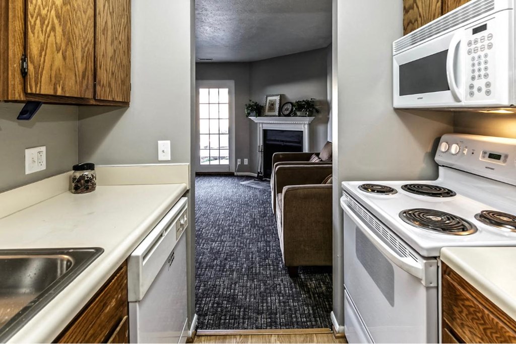 a kitchen with a stove microwave and a sink