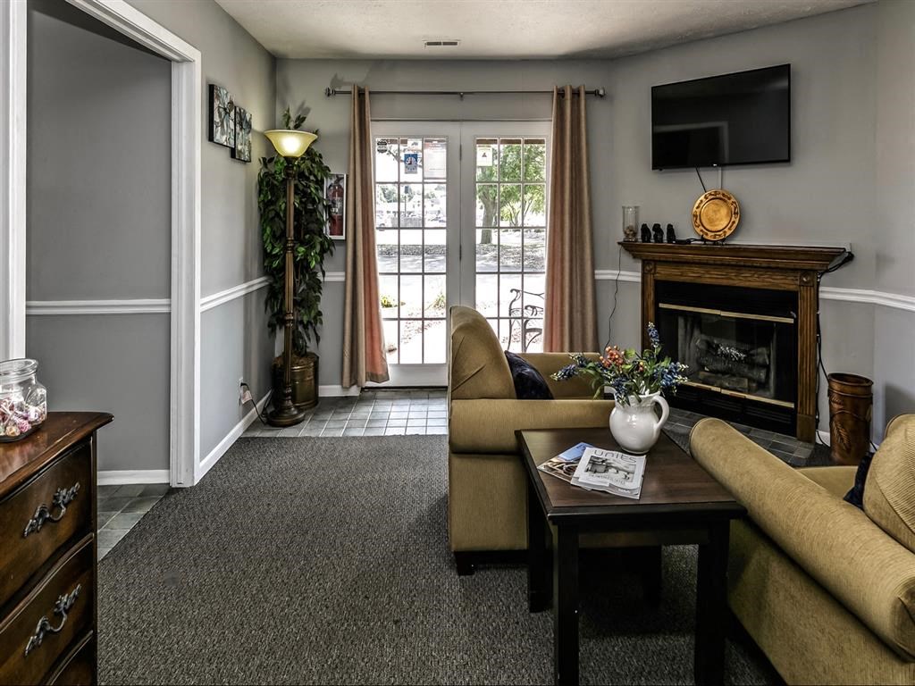 a living room with a couch and a fireplace