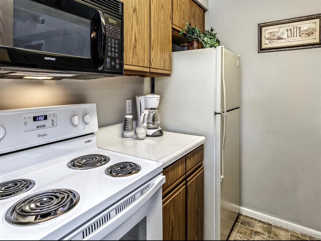 a kitchen with a stove microwave and refrigerator