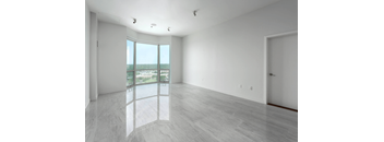 A room with a large window overlooking a beach at Clayton on the Park Apartments, Clayton, MO, 63105