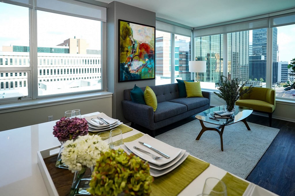 A modern dining room with a view of the city at Two Twelve Clayton Apartments, Clayton, Missouri