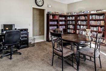 a dining room with a table and chairs