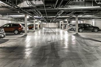 a parking garage with cars parked in it