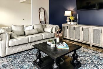 a living room with couches and a coffee table