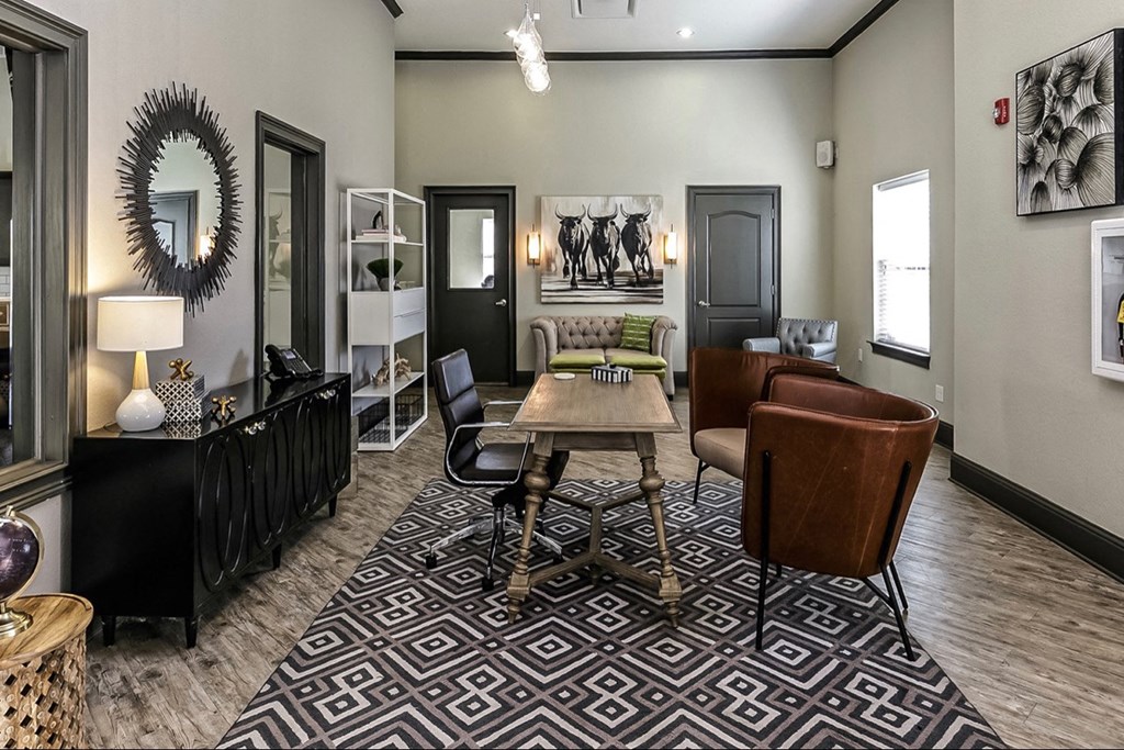 a living room with a dining room table and chairs