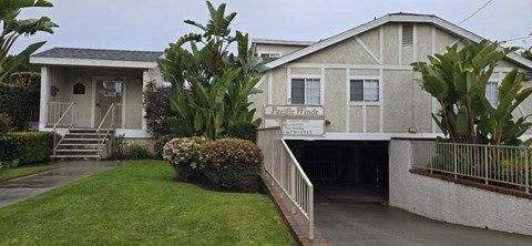 A building with a sign that says Pacific Winds.