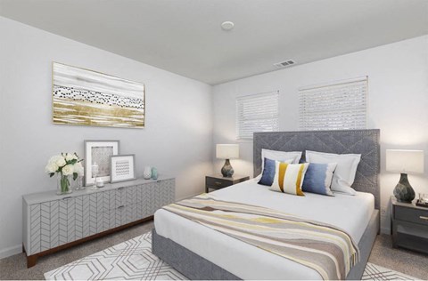 A bedroom with a large bed and a grey and white patterned dresser.