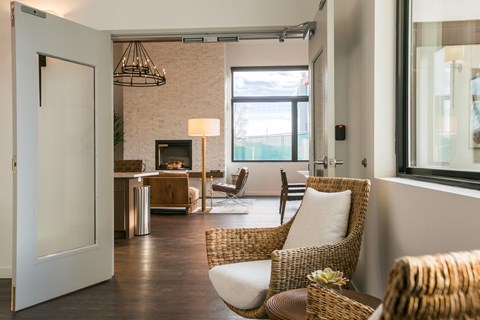 A living room with a fireplace and a chair.