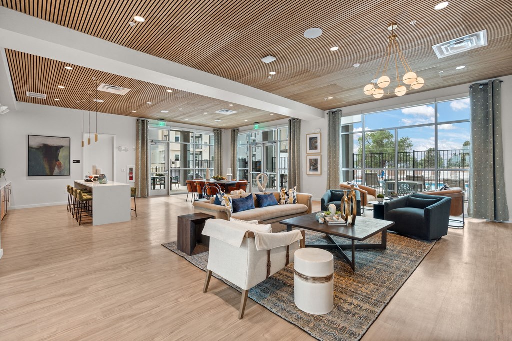 A modern living room with a fireplace and a large window.