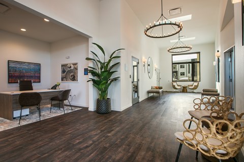 A modern office space with wooden floors and furniture.