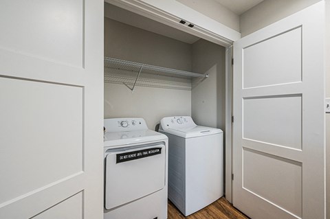 A laundry room with a washer and dryer.