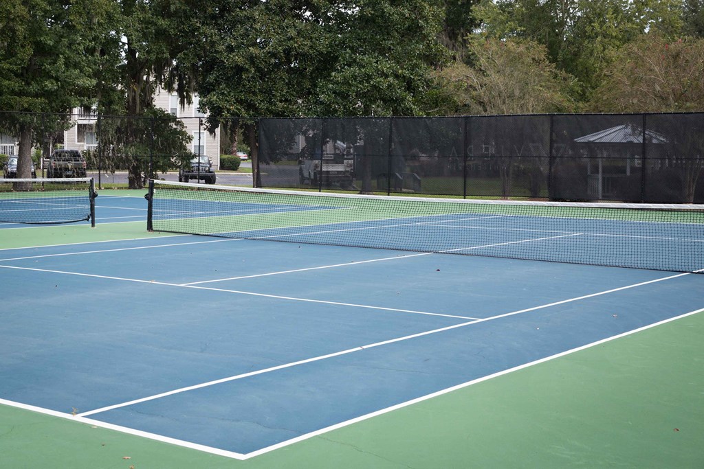 a tennis court with two tennis rackets on it