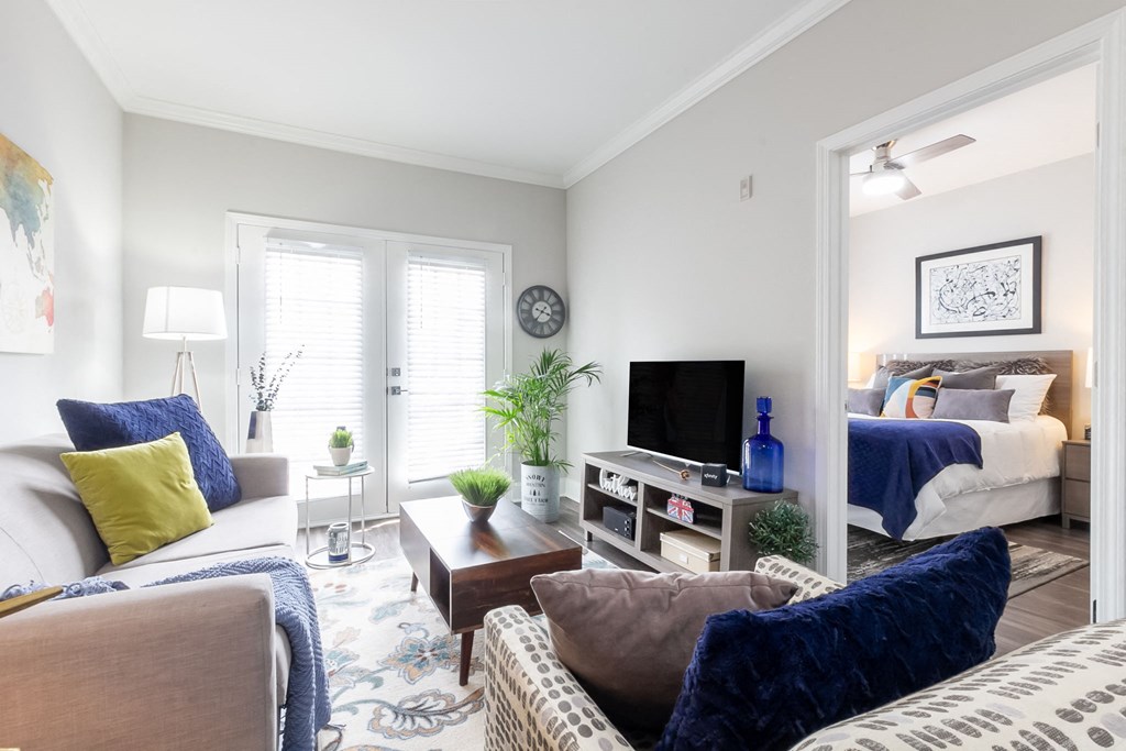 a living room with a couch and a tv