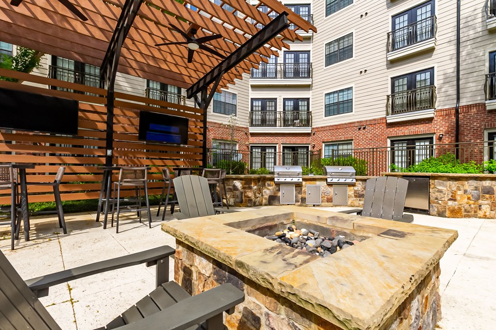 the preserve at ballantyne commons clubhouse with fire pit and patio furniture