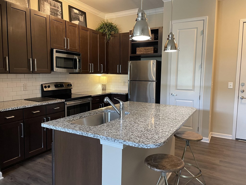 a kitchen with a granite counter top