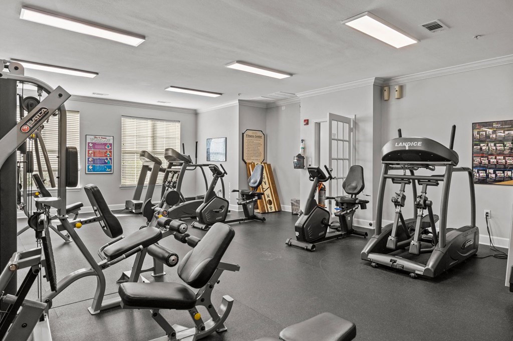 a gym with cardio machines and other exercise equipment