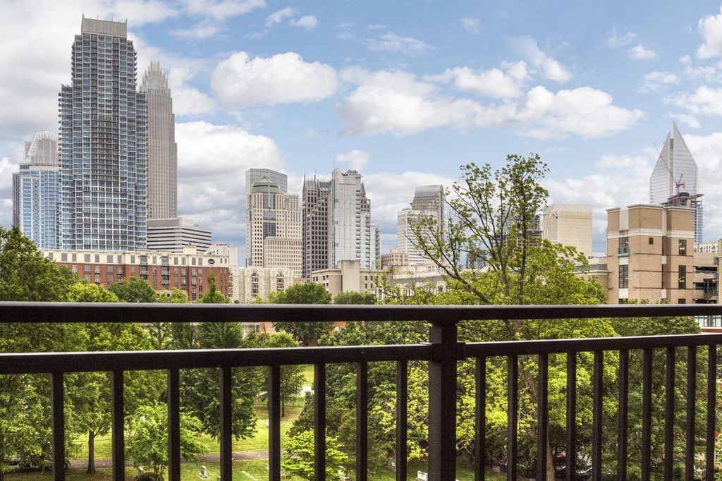 a view of the city skyline from a balcony