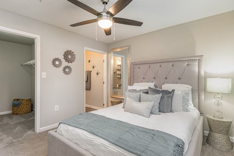 a bedroom with a bed and a ceiling fan at Litchfield Oaks Apartments, Pawleys Island, 29585