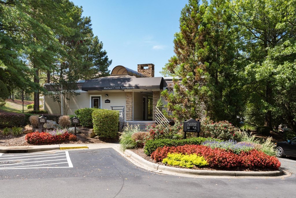 a house with a flower garden in front of it