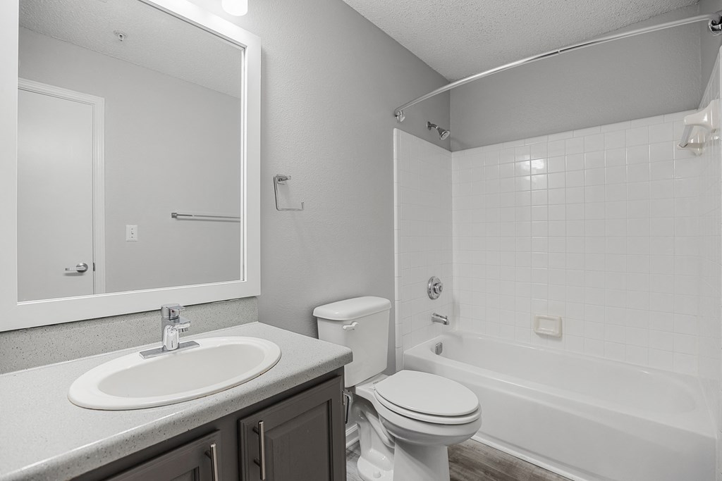 a bathroom with a sink toilet and a bath tub at Midtown Crossing in North Carolina 27609