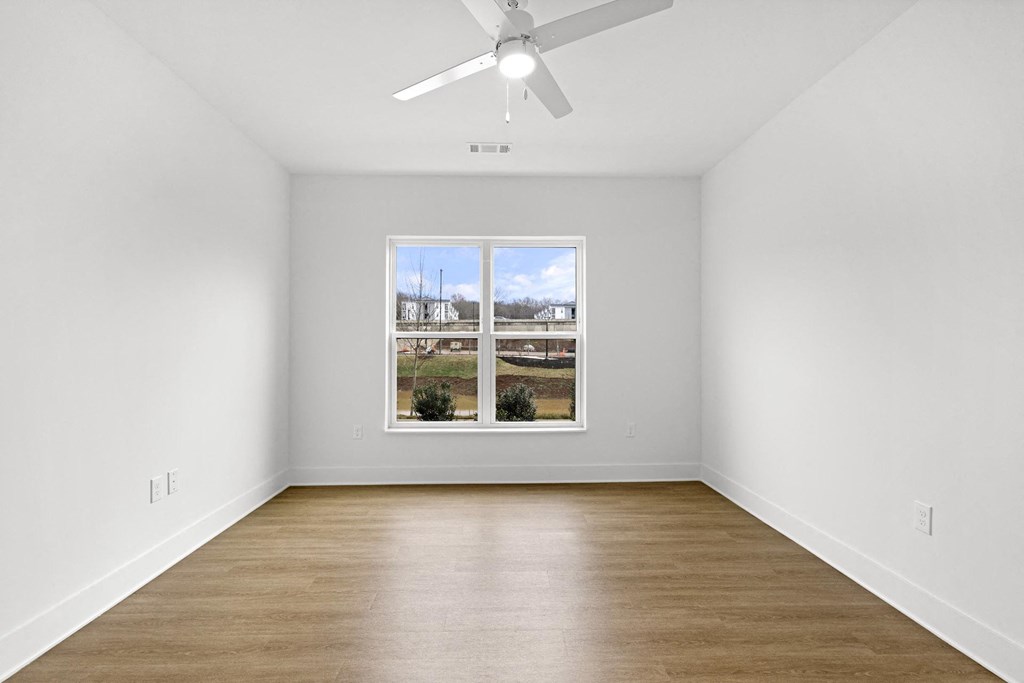 A room with a ceiling fan at Boardwalk at Research Park, Huntsville