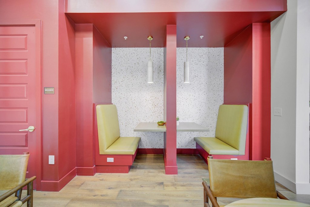 A room with a pink wall and a white wall with a pattern on it.