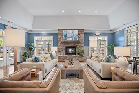 A living room with two couches and a fireplace.