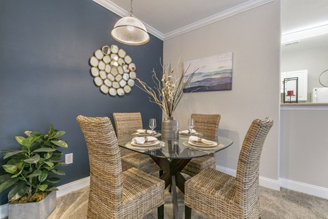 a dining room with a table and chairs