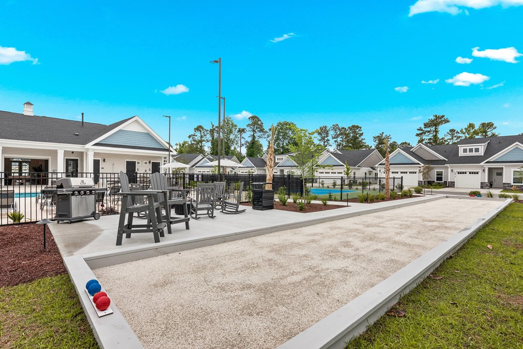 the preserve at ballantyne commons community clubhouse with tables and chairs and a yard