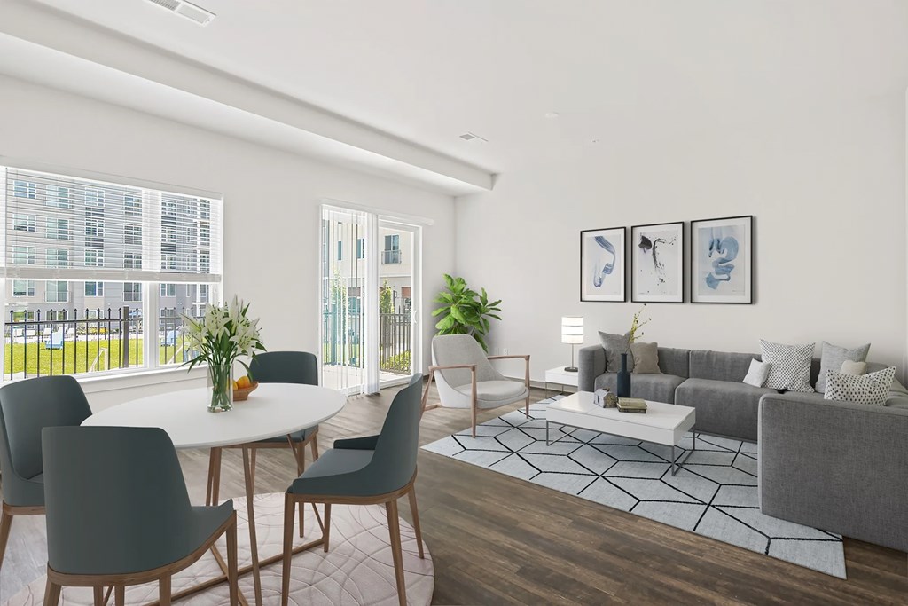a living room with a couch and a tableat Metropolis Apartments, Glen Allen, VA