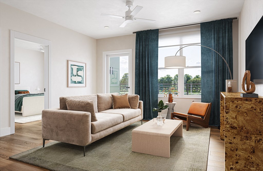 a living room with a couch and a coffee table at Boardwalk at Research Park in Huntsville, AL 35811