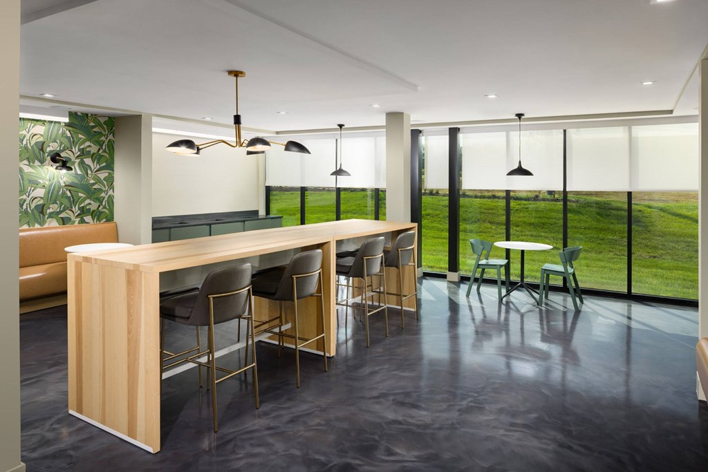 A conference room with a long table and chairs.