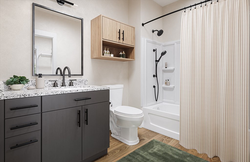 a bathroom with a shower and a sink and a toilet at Boardwalk at Research Park in Huntsville, Alabama 35811