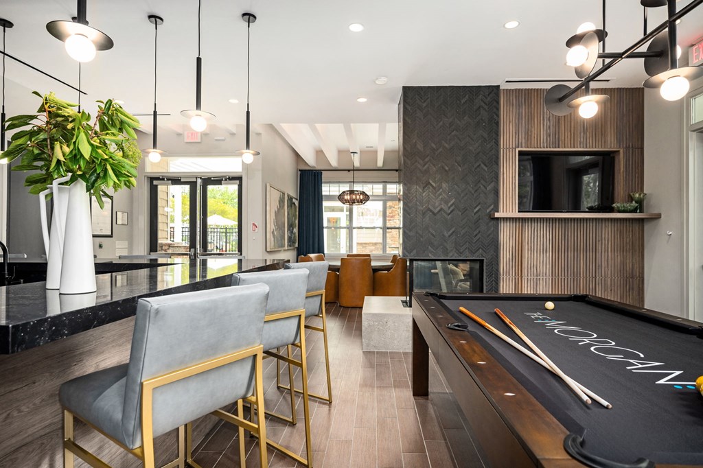 A pool table with the word "CROCKER" written on it in white chalk.