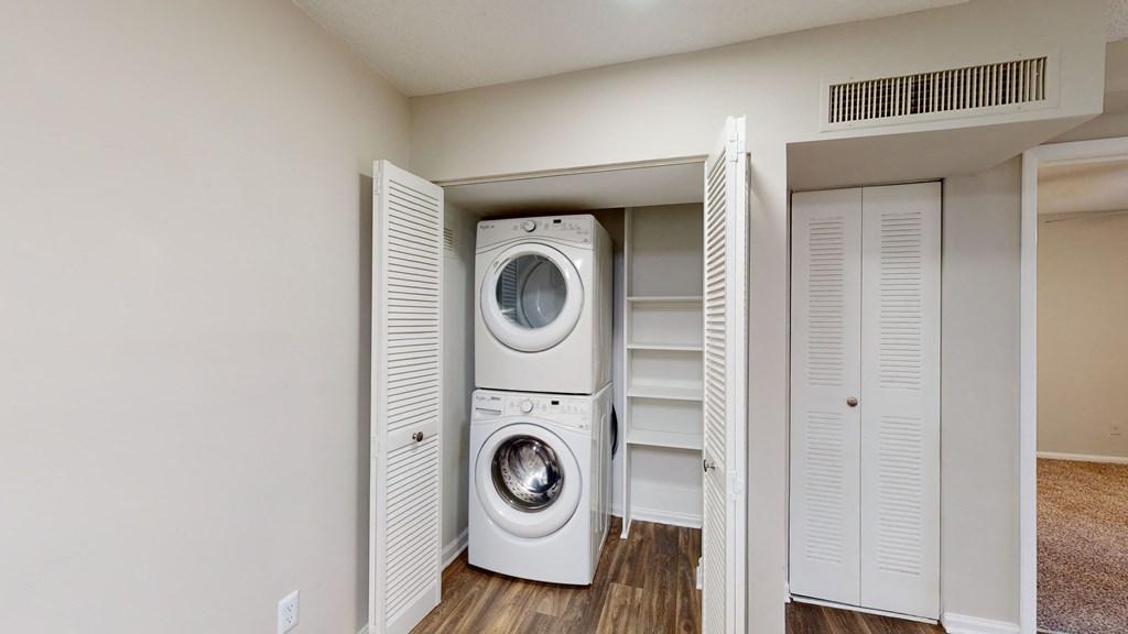 a washer and dryer in a small laundry room