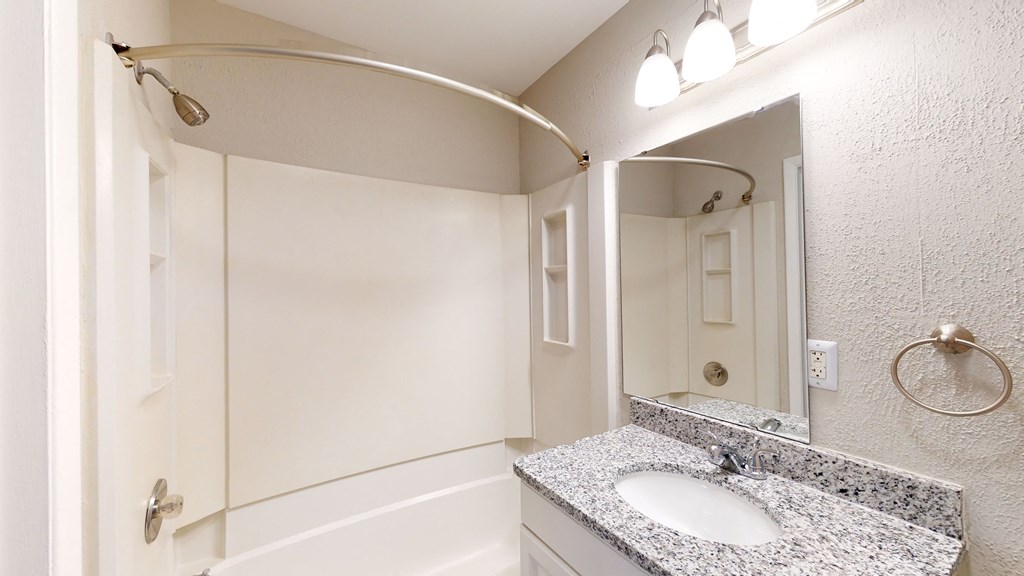 a bathroom with a sink and a bathtub