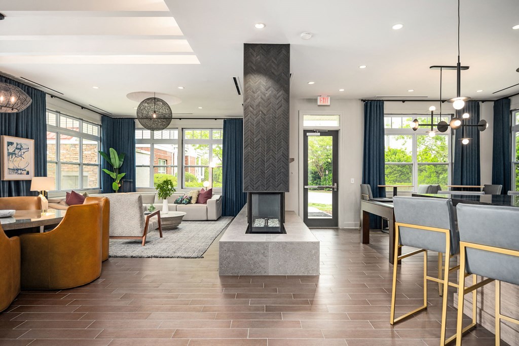 A modern living room with a fireplace and a dining table.