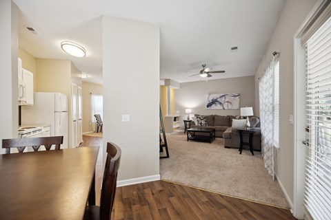 A living room with a brown table and a couch.