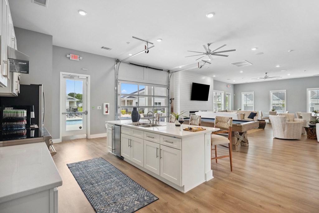 a living room with a kitchen and a dining room