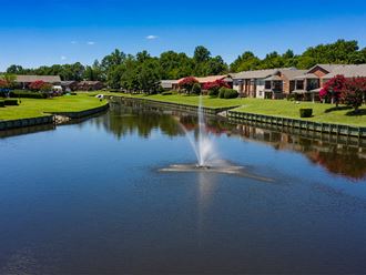 Canal and fountain at Holly Point Apartments