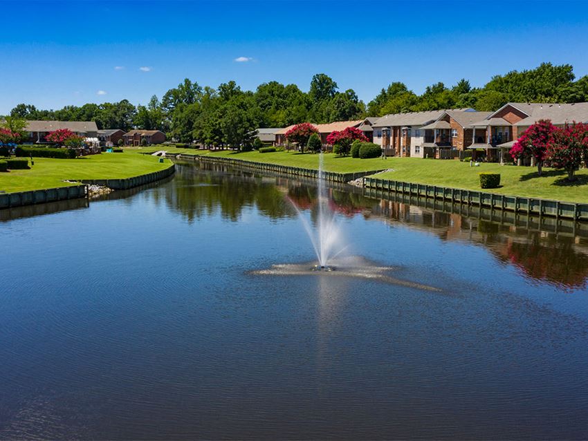 Canal and fountain at Holly Point Apartments - Photo Gallery 1