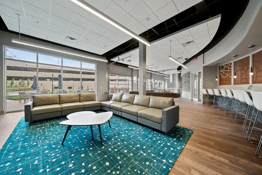 a lounge area with couches and a tableat Metropolis Apartments, Glen Allen, VA 23060