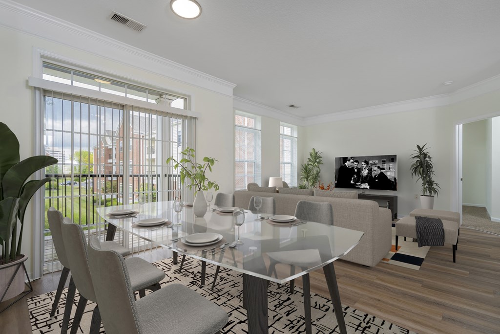 A modern dining room with a glass table and chairs.at Arlington Park, Ohio
