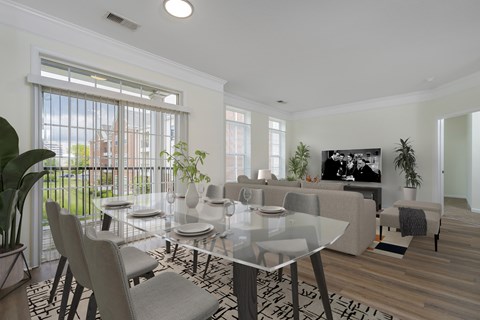 A modern dining room with a glass table and chairs.at Arlington Park, Ohio