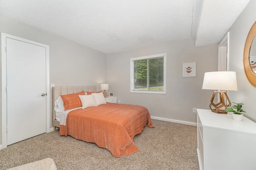 a bedroom with a bed and a window at Village 1373, Greensboro North Carolina
