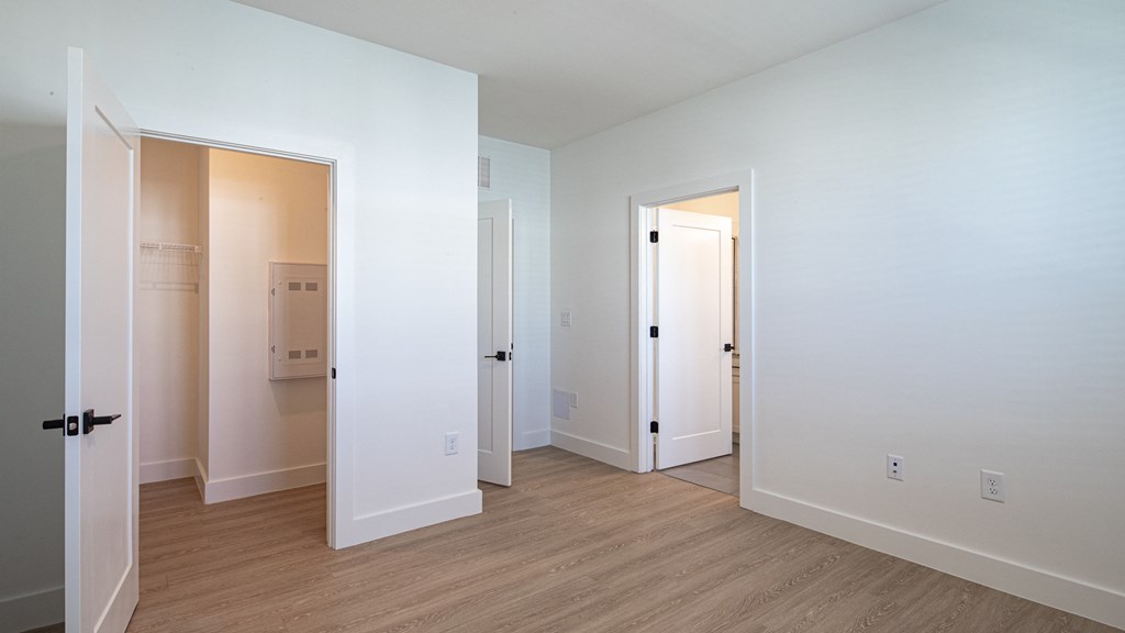 a bedroom with white walls and hardwood floors at Ainsworth, Virginia,3228