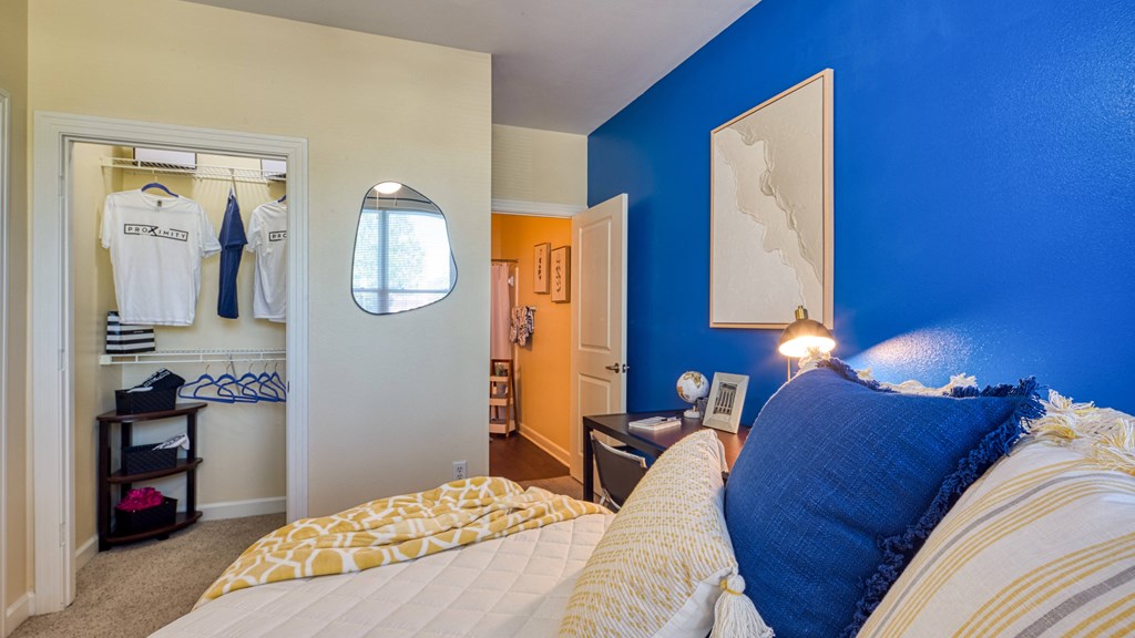 a bedroom with a bed and a closet at Proximity at ODU, Virginia, 23508