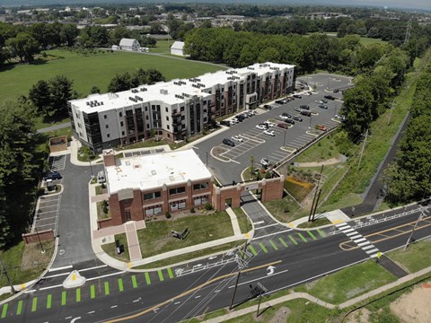 A large building with a parking lot in front of it.
