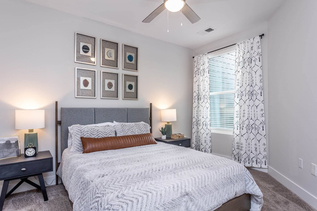 a bedroom with a bed and a ceiling fan at Centro at Pine Nash, Wilson, NC, 27893