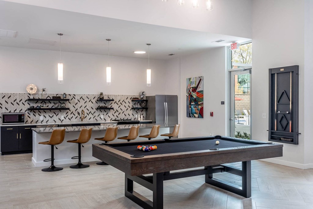 a game room with a pool table and a barat Centro at Pine Nash, Wilson, NC, 27893